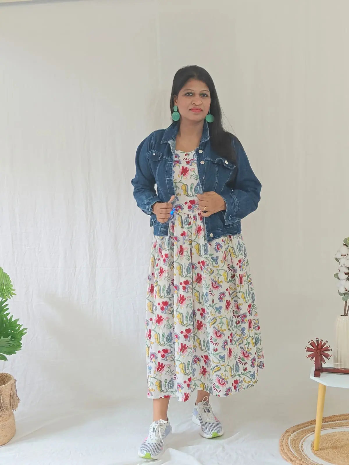 White Sanganeri dress styled with jacket — perfect for winter or casual wear.