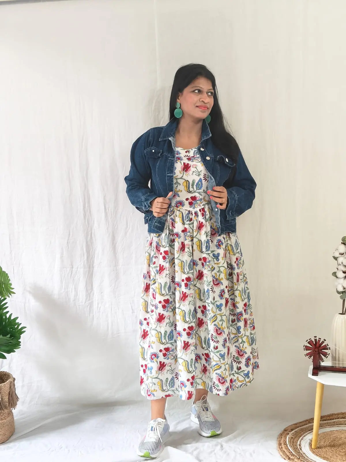 White Sanganeri dress styled with jacket — perfect for winter or casual wear.