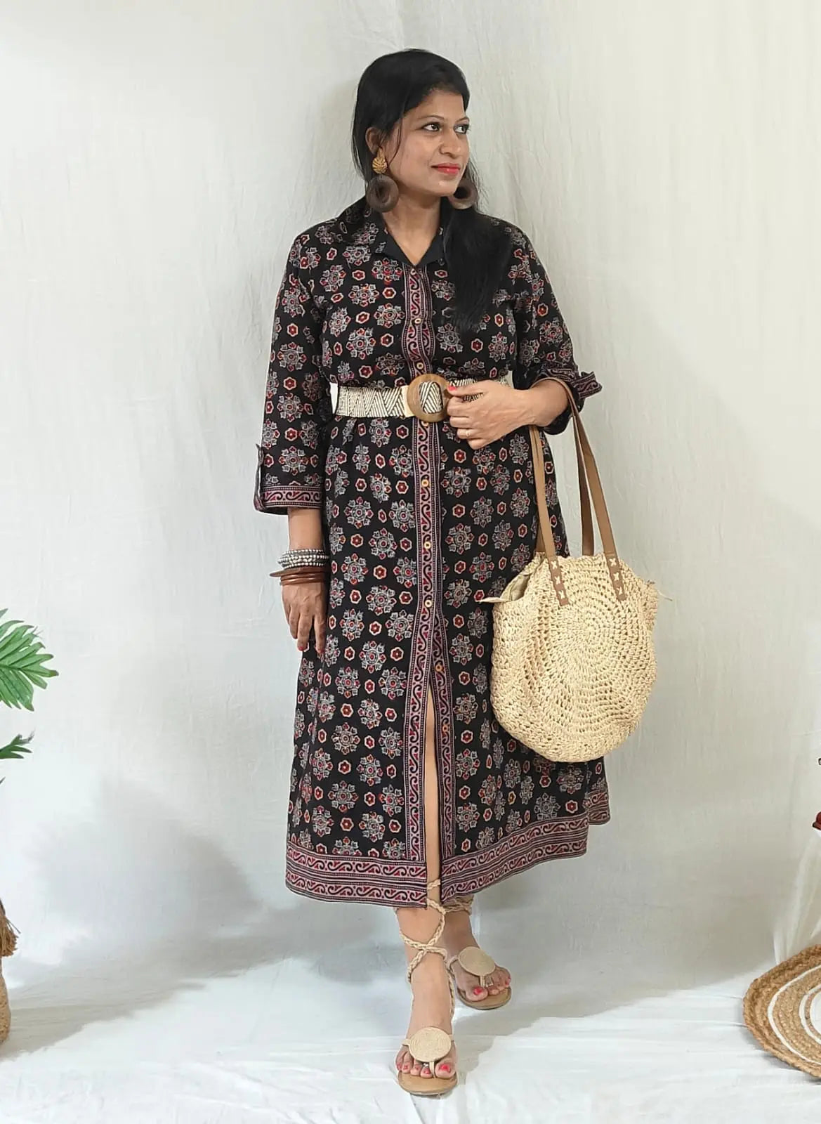 Shirt dress worn with front buttons open for slit, tied belt, styled with boho bag, tie-up flats & accessories.