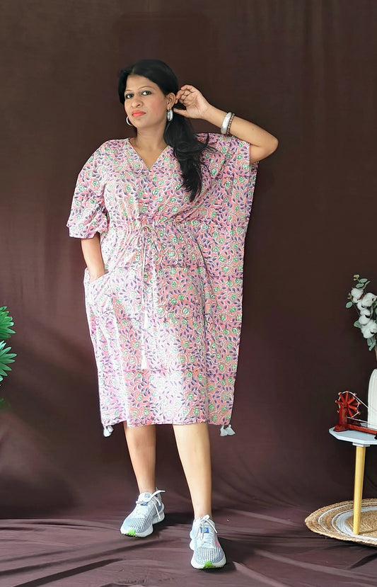 Front view of purple multi-print kaftan styled casually with flat shoes.