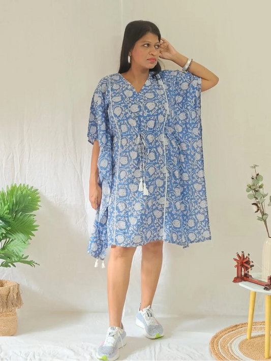 Front view of blue block print kaftan styled in a casual look.