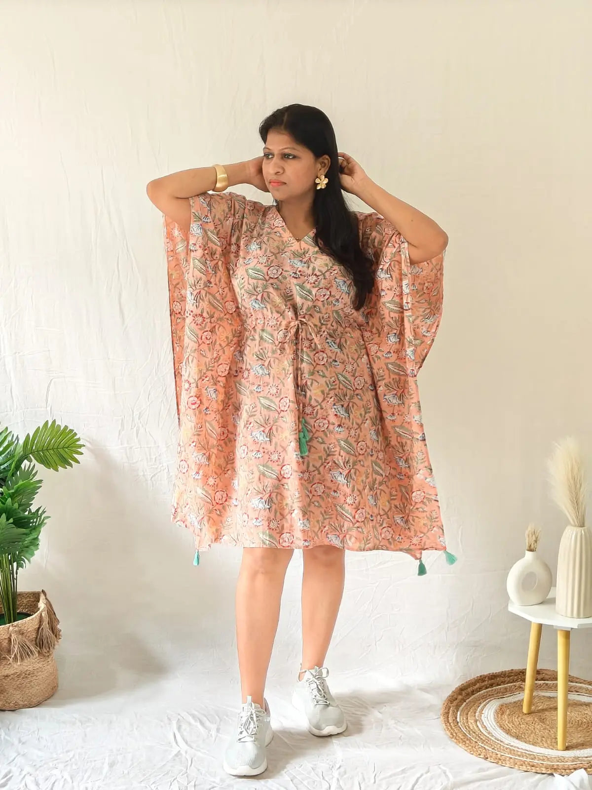 Model in peach Sanganeri cotton kaftan styled with casual shoes and minimal accessories
