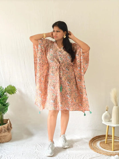 Model in peach Sanganeri cotton kaftan styled with casual shoes and minimal accessories
