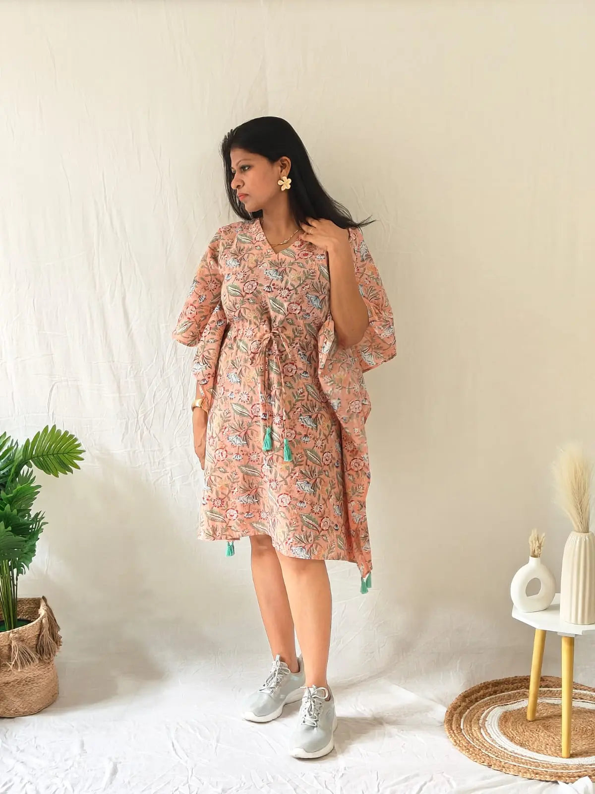 Model in peach Sanganeri cotton kaftan styled with casual shoes and minimal accessories