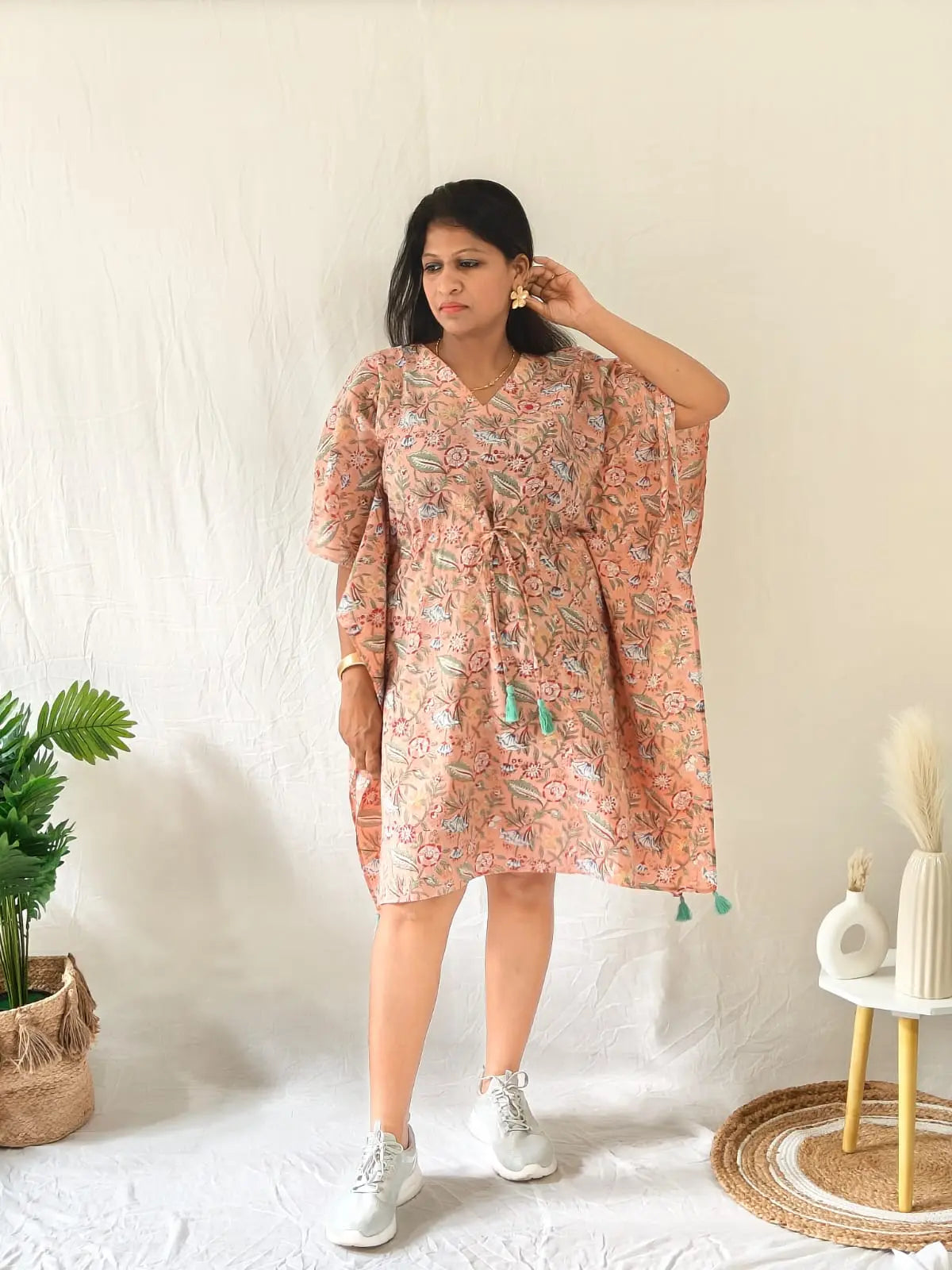 Model in peach Sanganeri cotton kaftan styled with casual shoes and minimal accessories