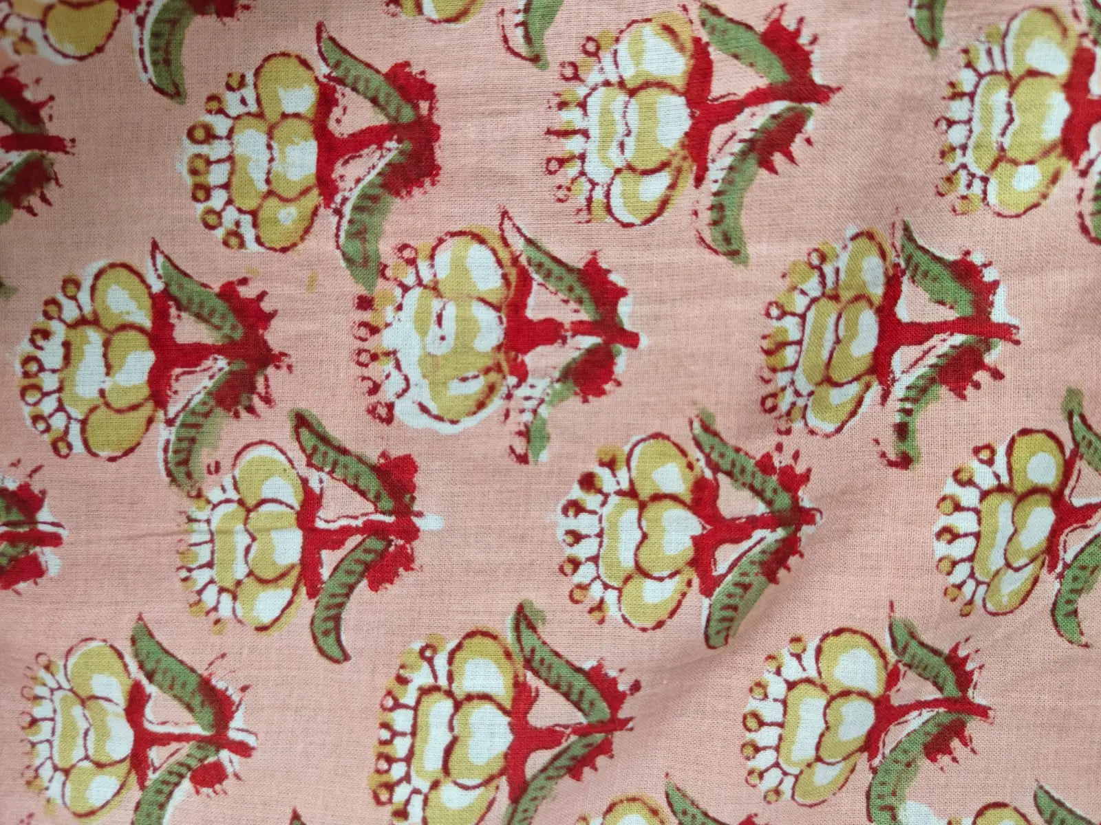 Zoomed-in view of peach kaftan fabric.