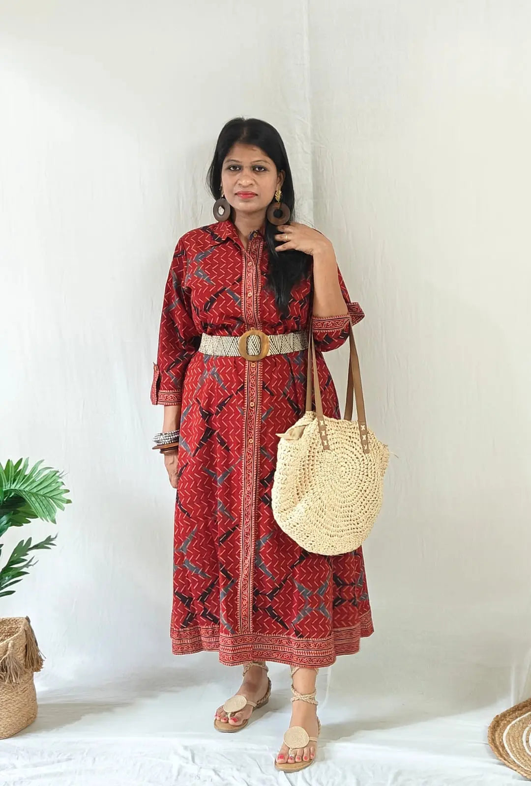 Shirt dress worn with front buttons open for slit, tied belt, styled with boho bag, tie-up flats & accessories.