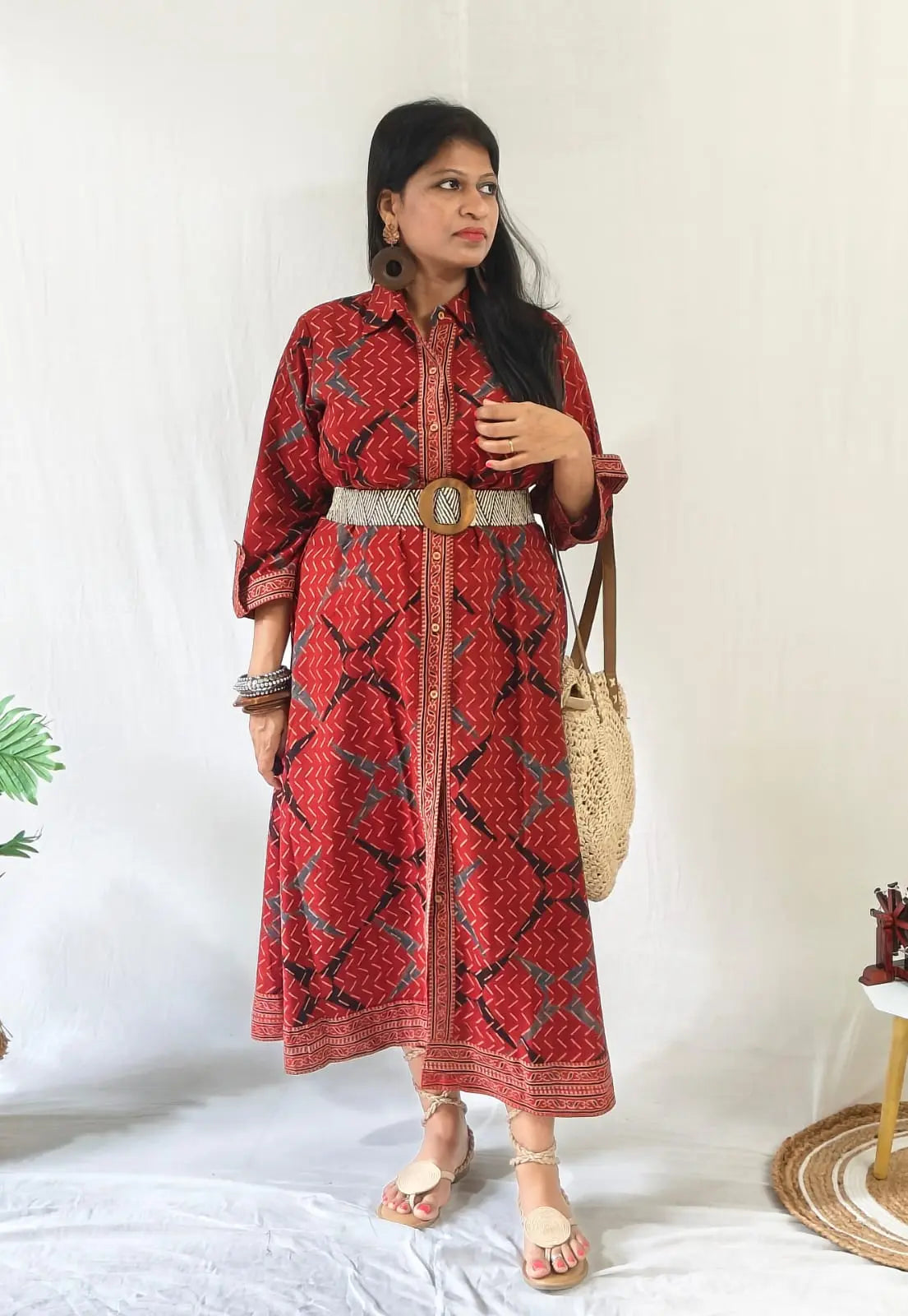 Shirt dress worn with front buttons open for slit, tied belt, styled with boho bag, tie-up flats & accessories.