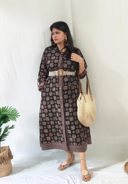 Shirt dress worn with front buttons open for slit, tied belt, styled with boho bag, tie-up flats & accessories.
