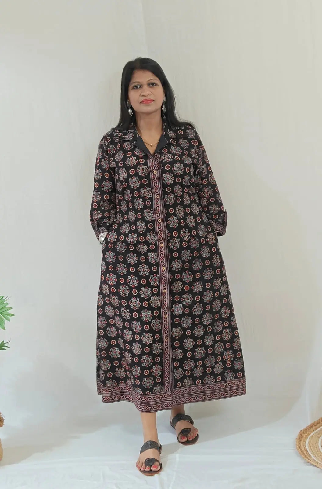 Shirt dress worn without tying the belt, styled casually with flats – front view