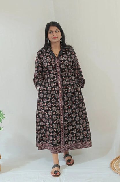 Shirt dress worn without tying the belt, styled casually with flats – front view