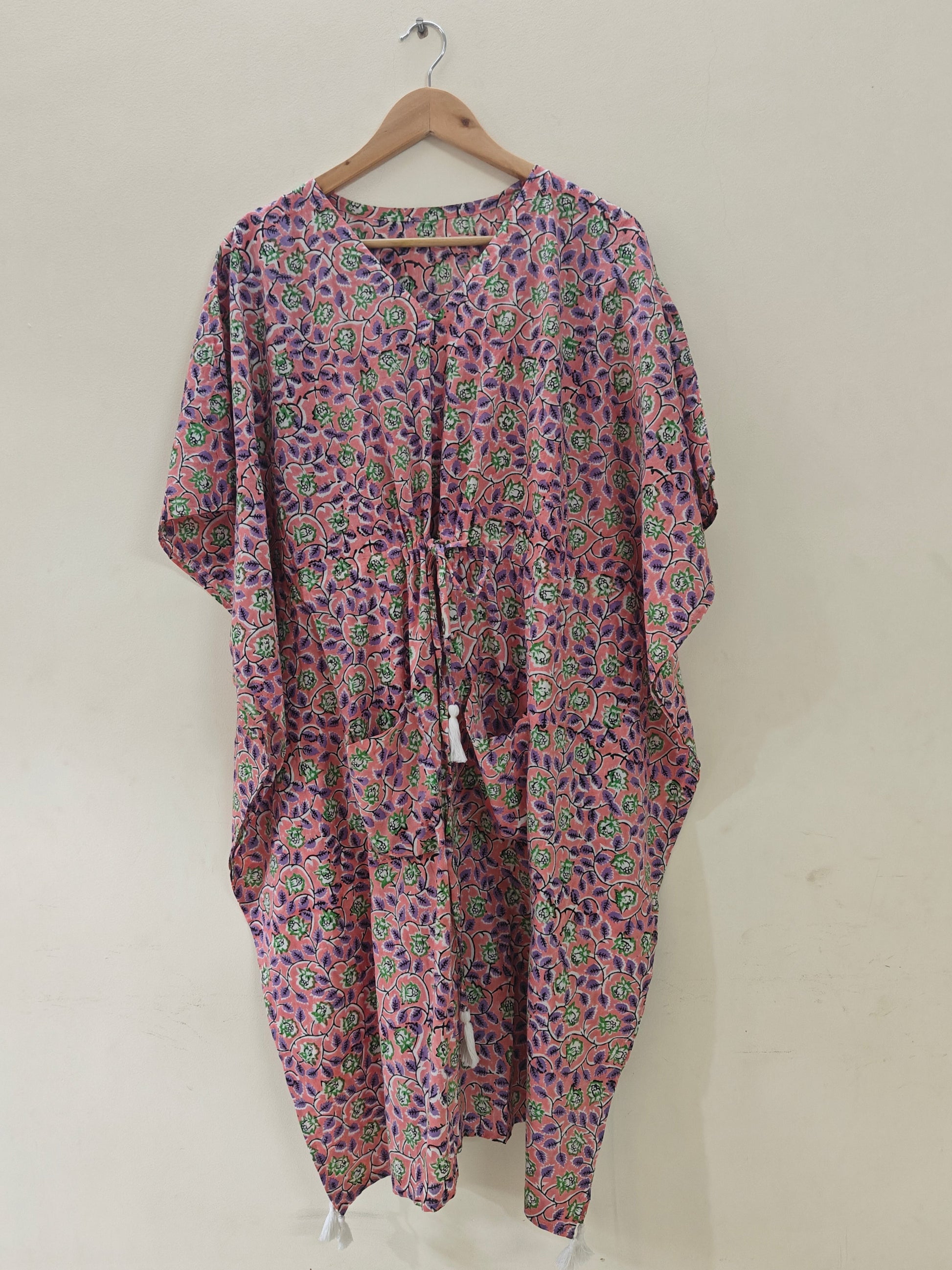 Purple multi-print kaftan on hanger, front view.