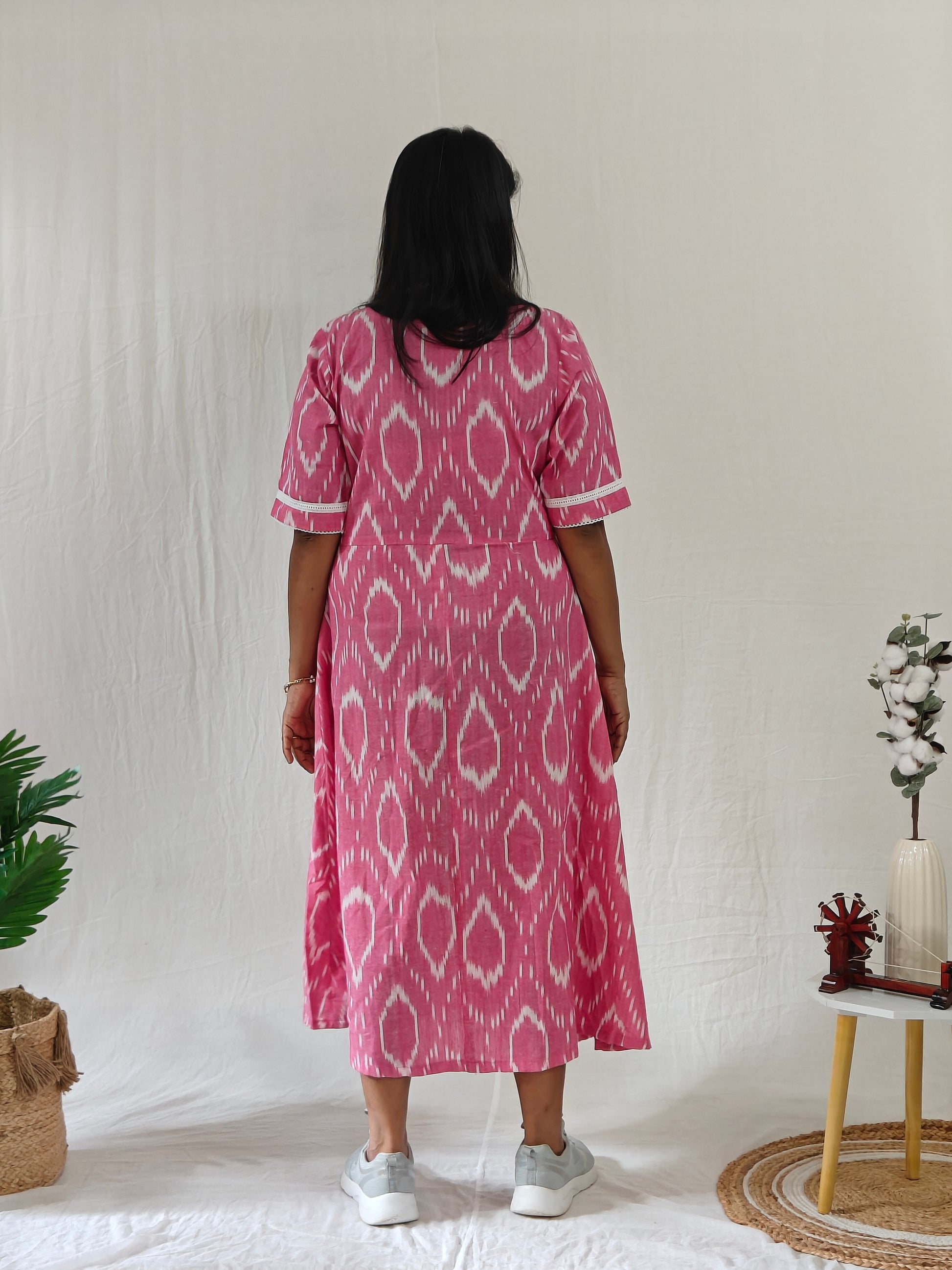 "Back view of Pink Ikat dress.