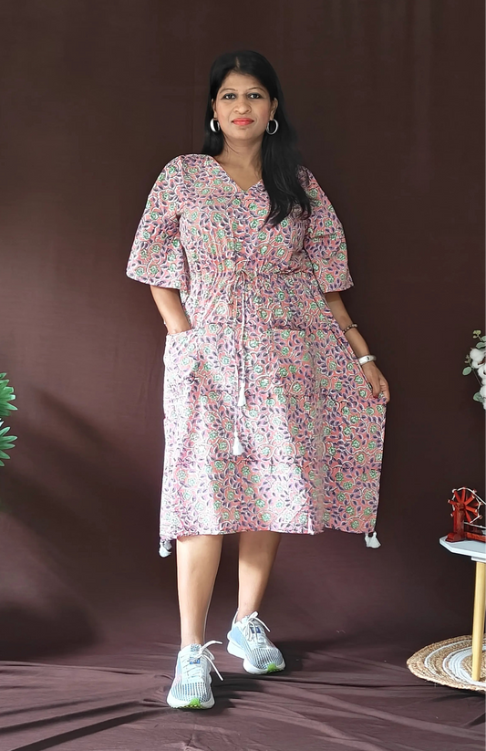Front view of purple multi-print kaftan styled casually with flat shoes.