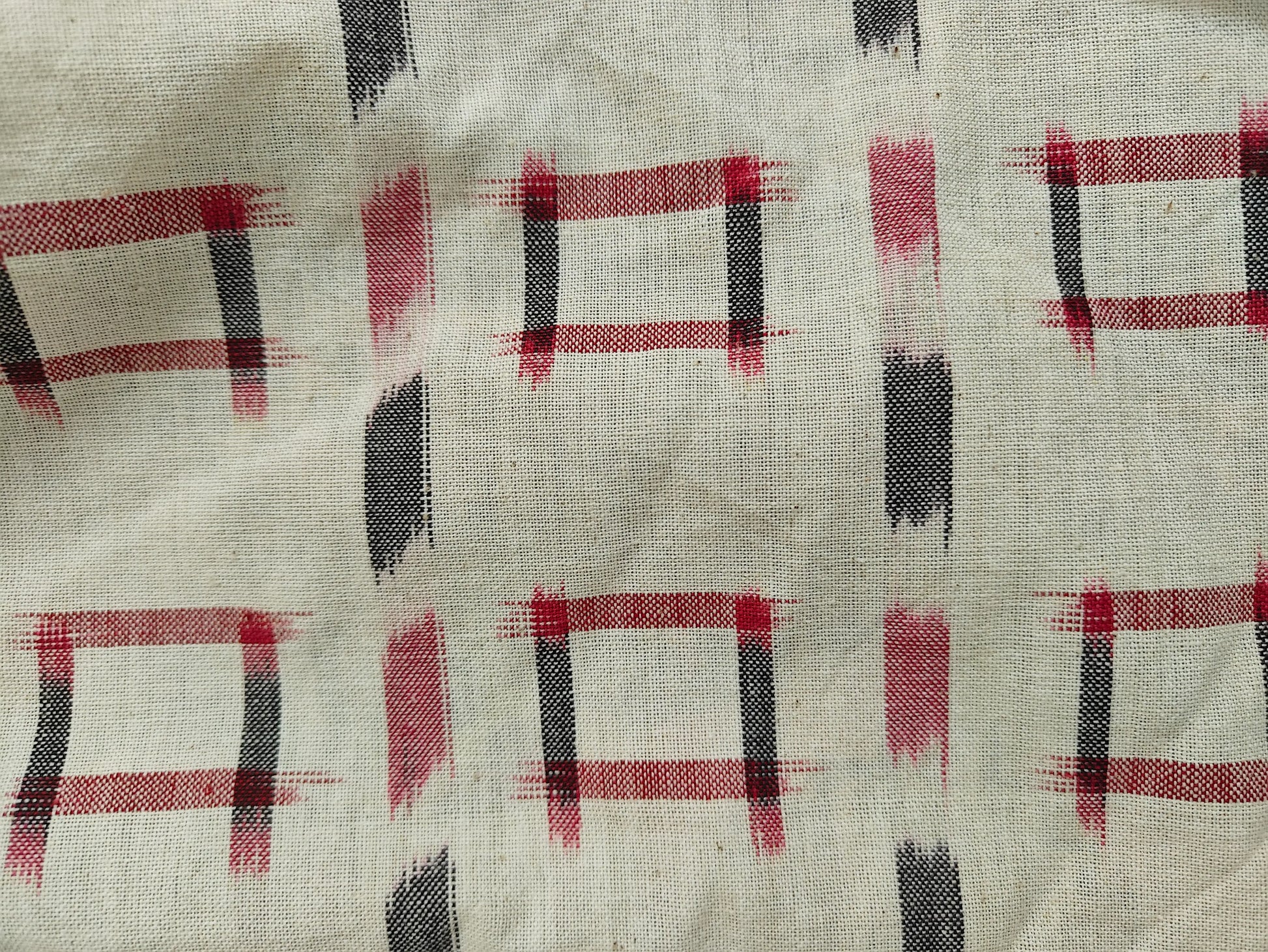 Zoom view of ikkat shift dress fabric showing detailed weave and texture.