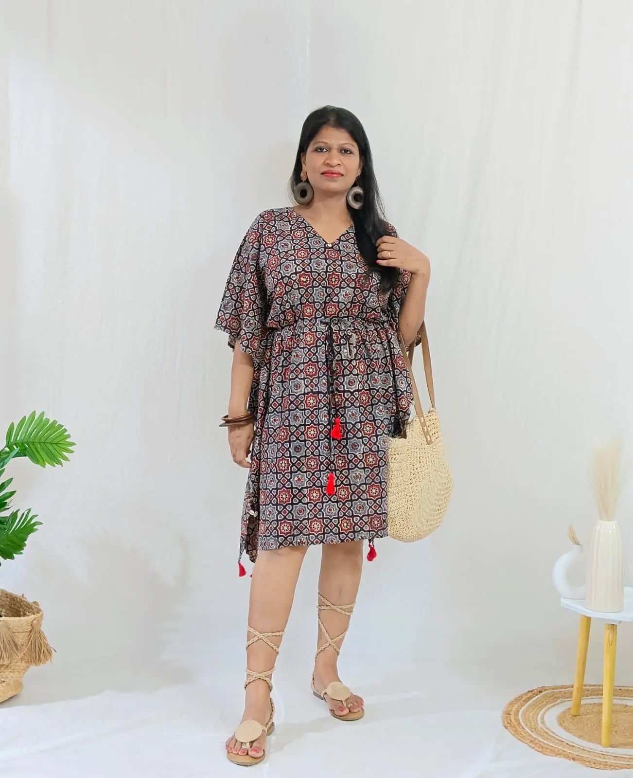 Kaari Ajrakh Blockprint Kaftan styled in boho look with bag, footwear, and accessories