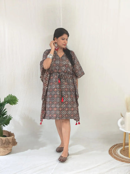 Ethnic look with Kaari Ajrakh Blockprint Kaftan, jutti, and oxidised chandelier jewelry.