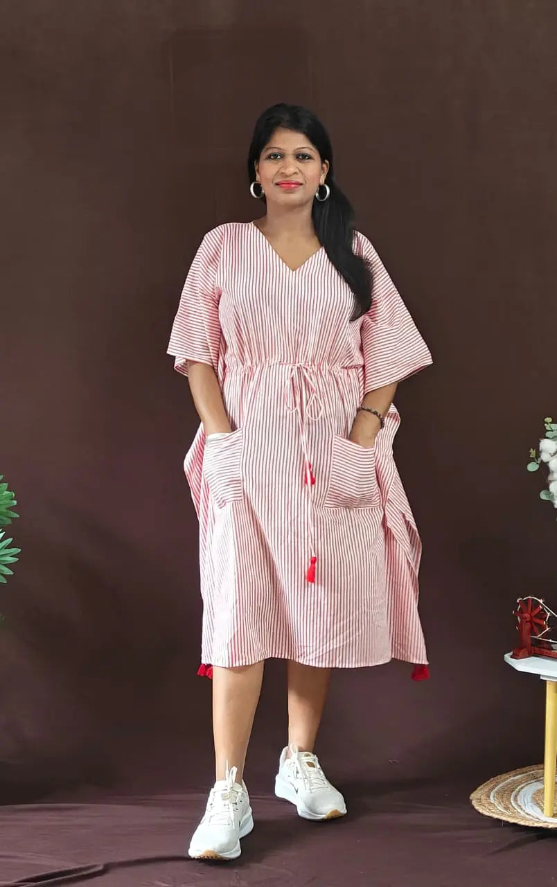 Front view of red striped kaftan styled in a casual look.