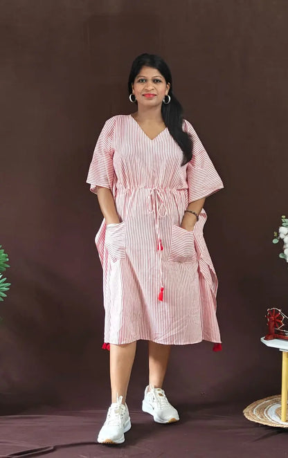 Front view of red striped kaftan styled in a casual look.