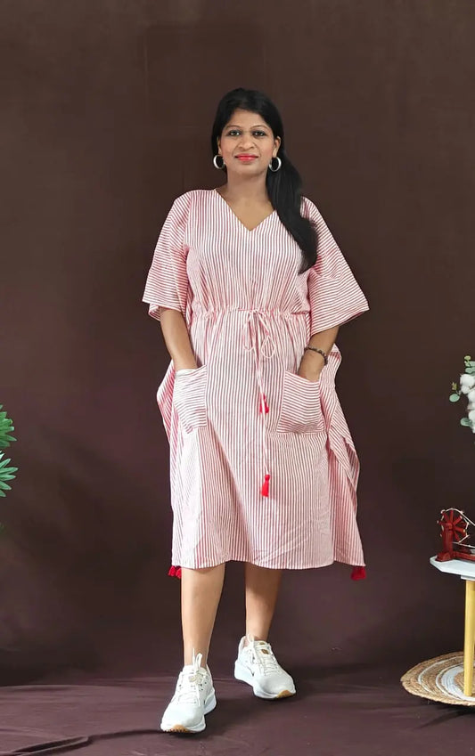 Front view of red striped kaftan styled in a casual look.