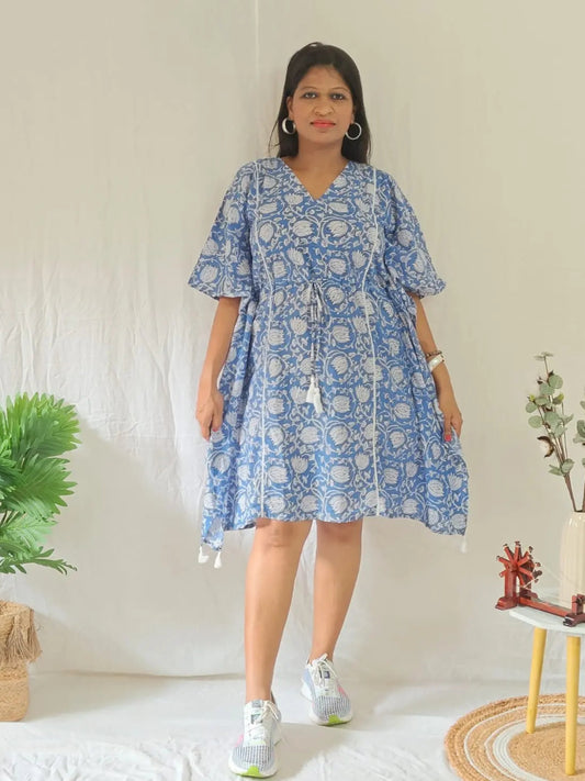 Front view of blue block print kaftan styled in a casual look.