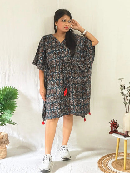 Front view of blue ajrakh block print kaftan styled casually with shoes.