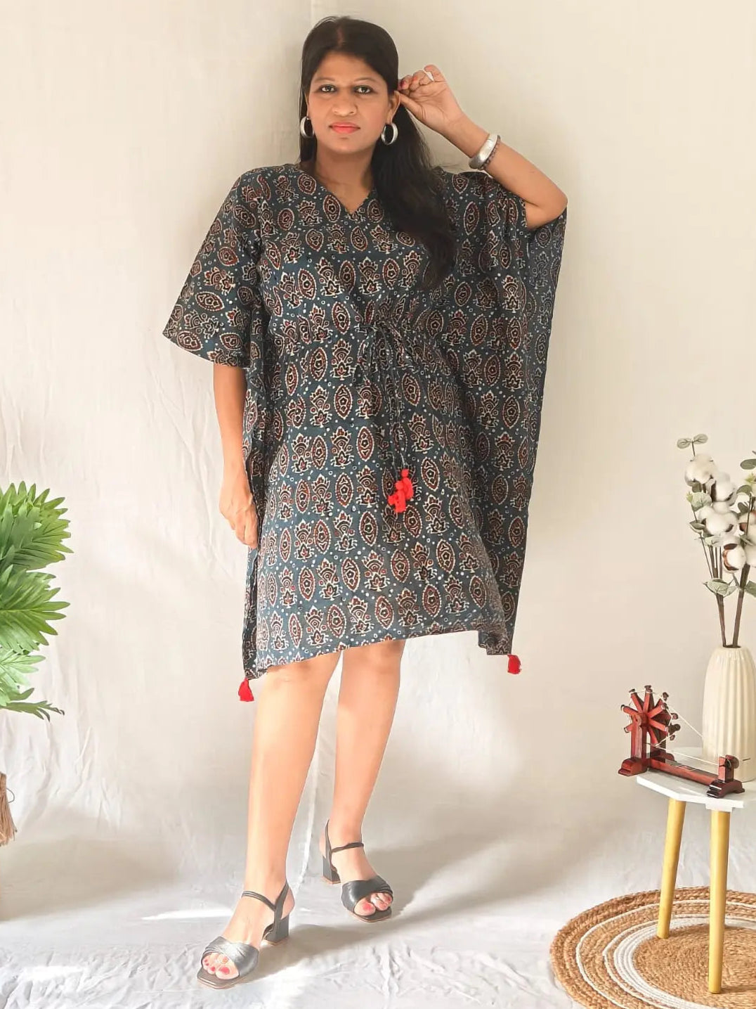 Front view of blue ajrakh block print kaftan styled with sandals.