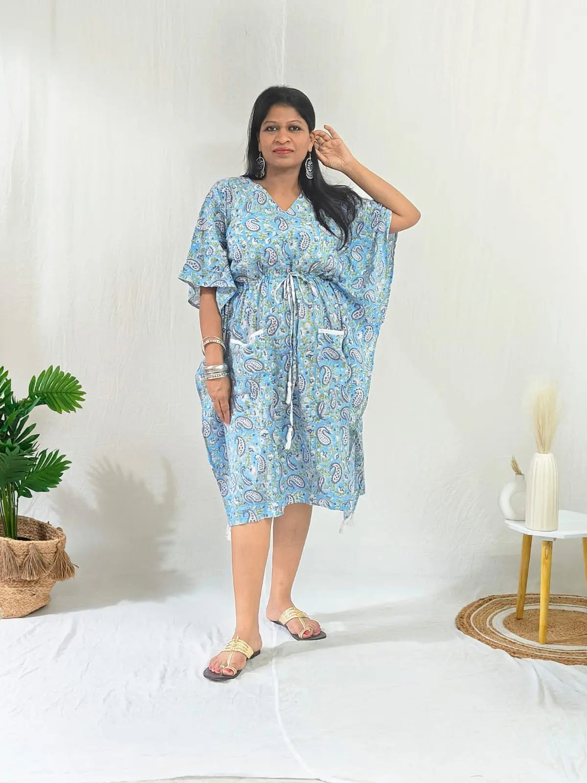Front ethnic look: blue kaftan, kolhapuri flats, and chandelier earrings.